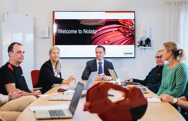 Nolato- employees in conference room